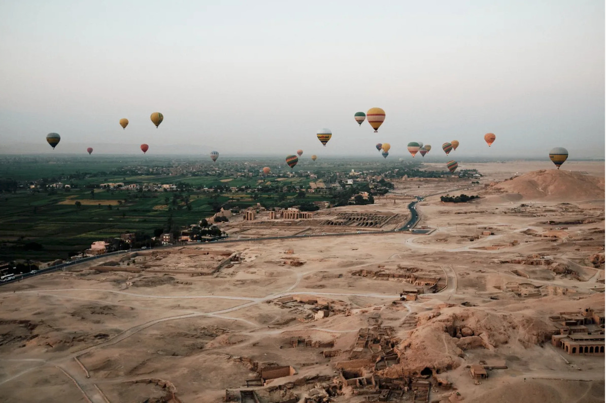 Hot air balloons over Luxor at sunrise